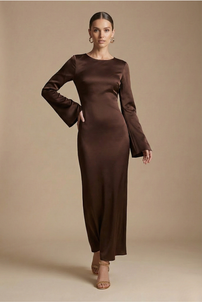 Brown satin maxi dress with long sleeves and round neckline, fitted column style