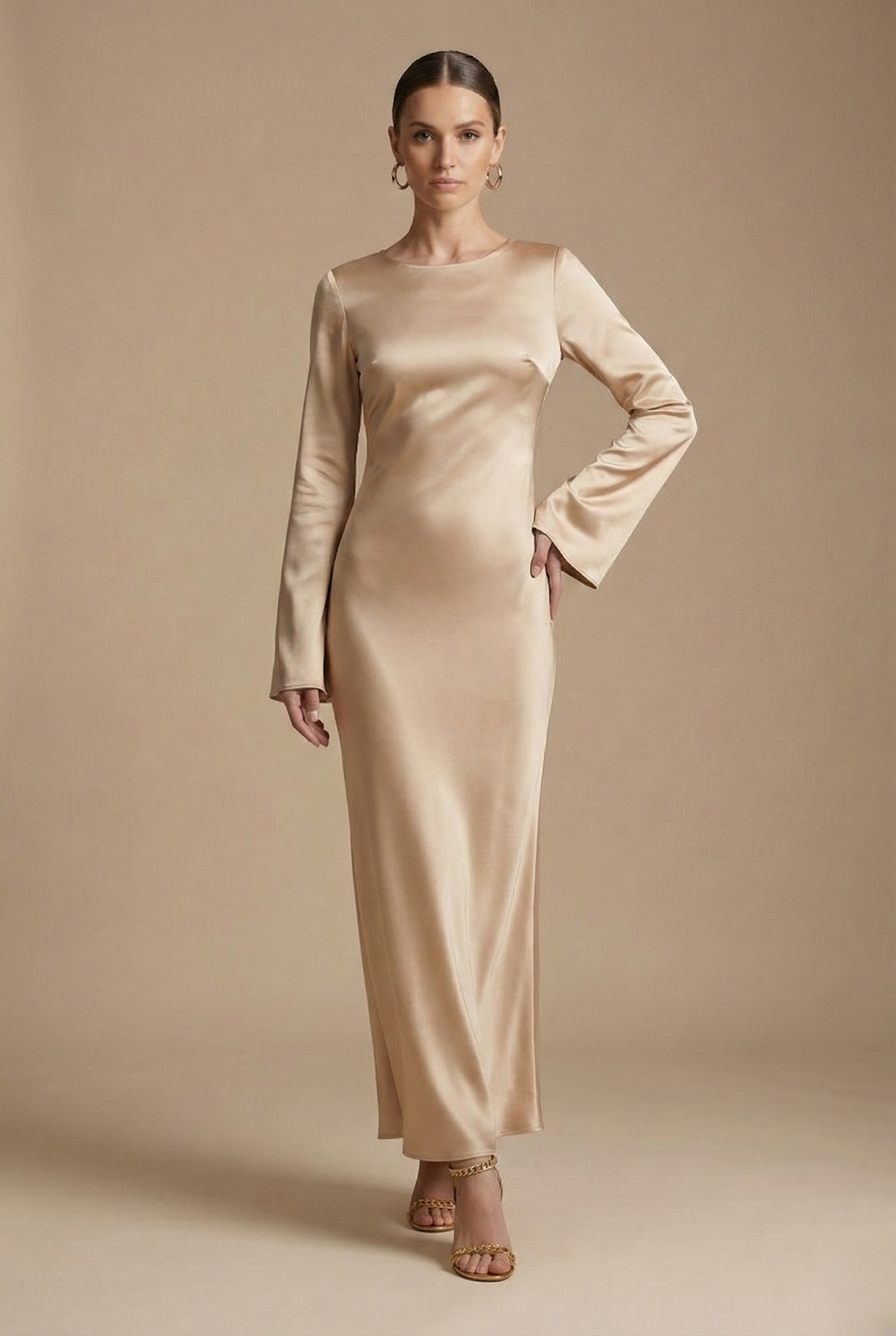 Sand satin maxi dress with long sleeves and round neckline, fitted column silhouette