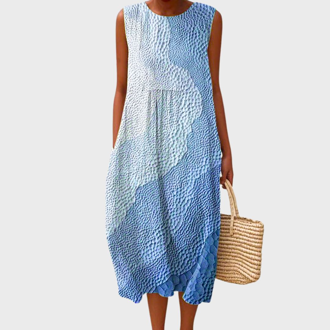Knee-length sleeveless light blue dress with textured ruffle panel detailing