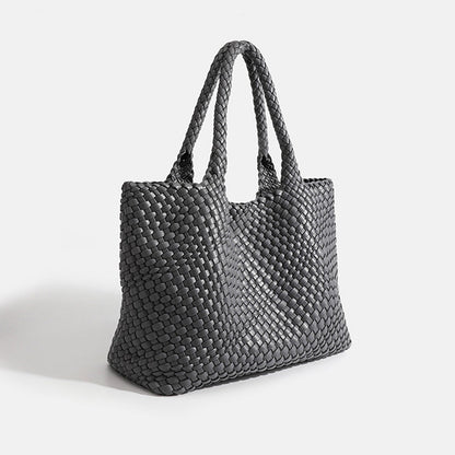 Dark gray woven tote bag with top handles and textured basket-weave fabric