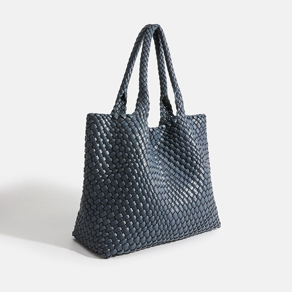 Blue-gray woven tote bag with top handles and textured basket-weave fabric