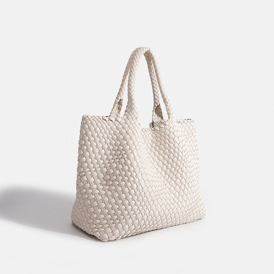 Off-white woven tote bag with top handles and textured basket-weave fabric