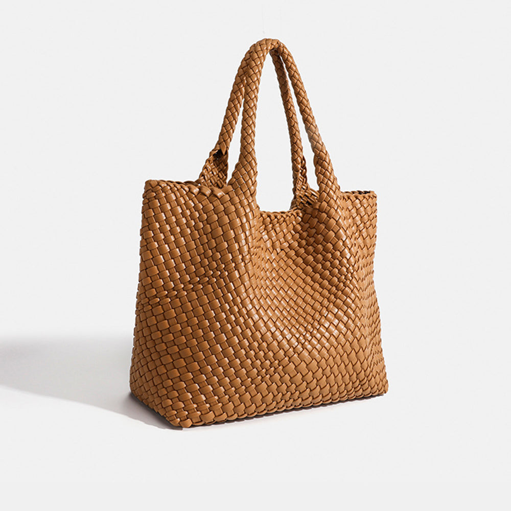 Brown woven tote bag with top handles and textured basket-weave fabric