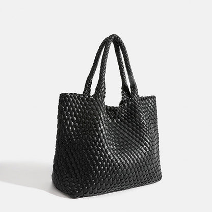 Black woven tote bag with top handles and textured basket-weave fabric
